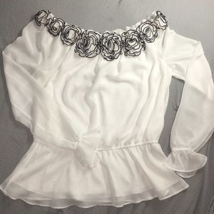 White and black flowy blouse